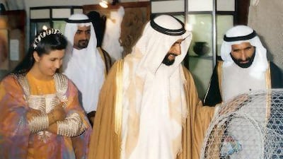 Reem Tariq El Mutwalli with Sheikh Zayed at an exhibition at the Cultural Foundation in the 1990s.