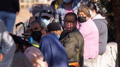 People wait in line as the Los Angeles Regional Food Bank distributes food outside in Los Angeles, California. Reuters