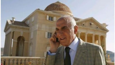 Palestinian millionaire Munib al-Masri speaks on his mobile phone on May 26, 2010 in the garden of his landmark house, known as the "House of Palestine" or the "People's House", outside the West Bank city of Nablus. Jaafar Ashtiyeh / AFP Photo