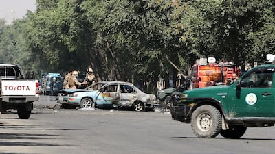 Members of Afghan security forces inspect the site of the blast. Reuters