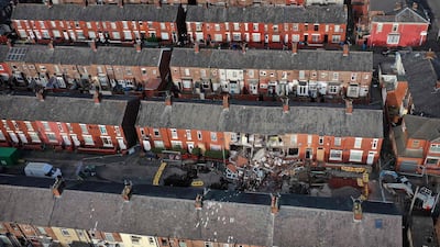 Investigators in northern England are looking into the cause of the sinkhole under Walmer Street in Abbey Hey, Manchester, on January 21. No one was seriously injured, but 17 homes were evacuated and the residents were housed in hotels. AFP