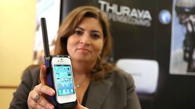 Thuraya executive Amal Ezzeddine shows off the SatSleeve. Delores Johnson / The National