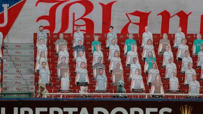 Cardboard figures of pictures of fans are seen on the stands before the start of the closed-door Copa Libertadores group phase football match between Ecuador's Liga de Quito and Brazil's Sao Paulo at the Rodrigo Paz Delgado stadium in Quito. AFP