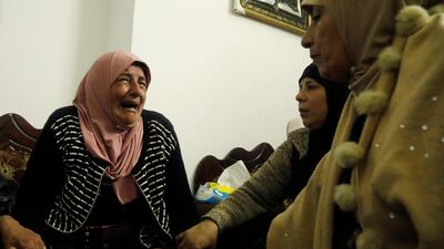 Relatives of Palestinian Bader Nafilah, who was killed during clashes with Israeli troops, mourn during his funeral in Qaffin in the Israeli-occupied West Bank. REUTERS