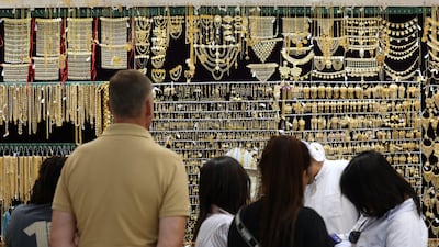 Customers at a jewellery shop in Dubai. The value of gold passing through the UAE last year was $186 billion. EPA