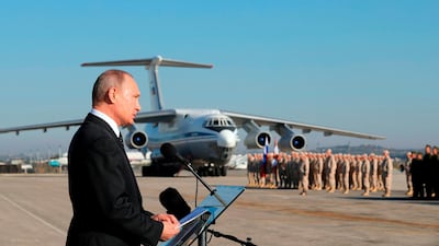 Russian President Vladimir Putin addresses troops at Hmeimim airbase in Syria. Mikhail Klimentyev / pool photo via AP