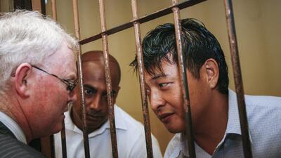 A file picture of Australian Andrew Chan, right, and Myuran Sukumaran, centre, talking to their lawyer before their final appeal against their death sentence at Denpasar District Court in Bali, Indonesia on October 8, 2010. Made Nagi/EPA