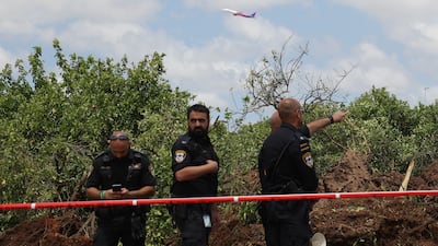 Police inspect the damage caused by the missile. EPA