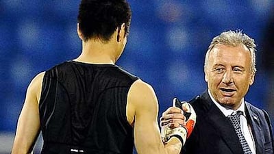 Alberto Zaccheroni, centre, says he loves working with Japan's players for their postivie approach.