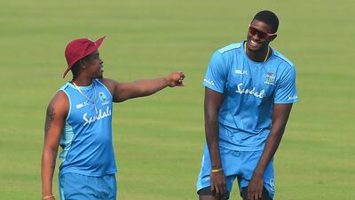 West Indies' Shimron Hetmyer, left, and Jason Holder train on the eve of the third ODI against India in Cuttack. AP
