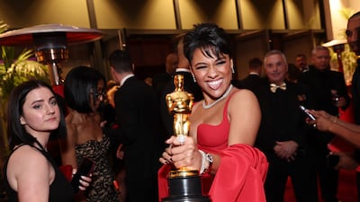 Ariana DeBose shows off her Oscar after scooping the Best Supporting Actress gong for Westside Story at last year's ceremony. AFP