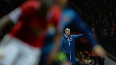 Arsenal manager Arsene Wenger directs his side during their FA Cup match against Manchester United on Monday night. Nigel Roddis / EPA