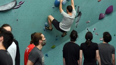 Climbers take part in the reopening of a climbing club in Paris. AFP