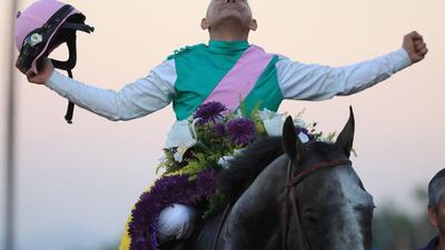 Jockey Mike Smith riding Arrogate celebrates after winning the Breeders' Cup. Sean M. Haffey / AFP