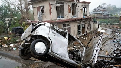 Destroyed house and vehicle are seen following a strong wind in Ichihara, Chiba, near Tokyo. Tokyo and surrounding areas braced for a powerful typhoon forecast as the worst in six decades, with streets and trains stations unusually quiet Saturday as rain poured over the city. AP