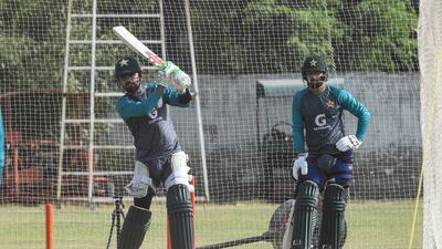Pakistan captain Babar Azam bats as teammate Abdullah Shafique watches during a practice session in Lahore. AFP
