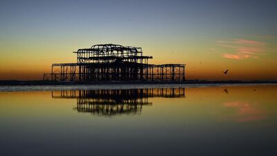 A mumeration of starlings flock to the remains of Brighton’s west pier. Glyn Kirk / AFP Photo