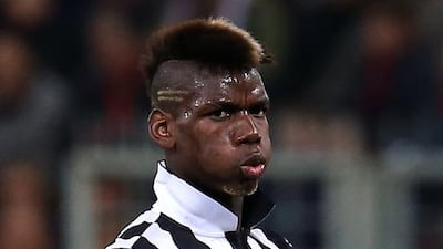 Juventus' French midfielder Paul Pogba reacts during the Italian Serie A match against Genoa on October 29, 2014, at Luigi Ferraris Stadium in Genoa. Marco Bertorello / AFP