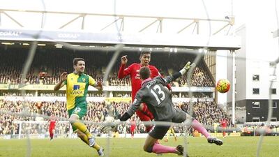 Liverpool’s Roberto Firmino scores his second goal for the 3-3 equaliser against Norwich City on Saturday. John Sibley / Action Images / Reuters
