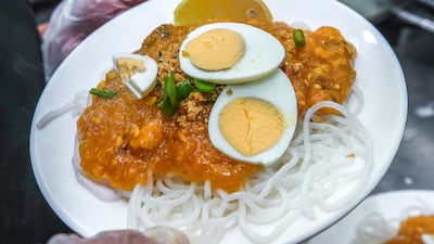 Pancit lug lug is a noodle dish made from a buttery, bisque–like shrimp sauce tossed with white rice noodles and topped with chicharon and crisp-fried chicken skin. The sauce is made from ground shrimp heads and shells blended with annatto seeds, water and corn starch. The dish is usually topped with a hard-boiled egg