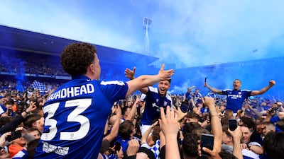 Ipswich Town players celebrate promotion to the Premier League with fans. Getty Images