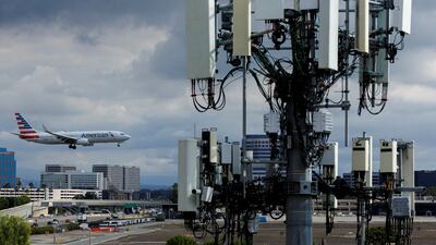 An American Airlines commercial aircraft flies past a cell phone tower as it approaches to land at John Wayne Airport in Santa Ana, California, on January 18. Reuters