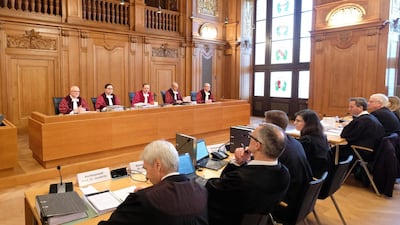 Judges and lawyers sit at the beginning of the hearing in a hall of the Federal Administrative Court on February 22, 2018 in Leipzig, eastern Germany, where the court possibly will deliver a verdict on the legality of banning driving diesel cars when pollution reaches high levels. Since Volkswagen admitted in 2015 to installing software to fool regulatory emissions tests in millions of cars worldwide -- the so-called "dieselgate" scandal -- nitrogen oxide (NOx) and fine particle emissions from diesel motors have been the top priority for German environmentalists. / AFP PHOTO / dpa / Sebastian Willnow / Germany OUT