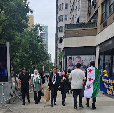 Syrians carrying their country's flag in New York. Mohamad Ali Harisi / The National