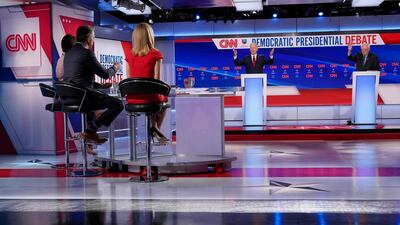 Moderators Univision's journalist Ilia Calderon, hidden, CNN chief Washington correspondent Jake Tapper and CNN political correspondent Dana Bash listen. AFP
