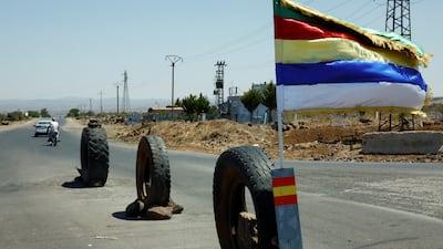 A Druze flag flutters along a street after deadly clashes between Druze fighters, Sunni Bedouin tribes and government forces, in Syria's predominantly Druze city of Sweida. Reuters