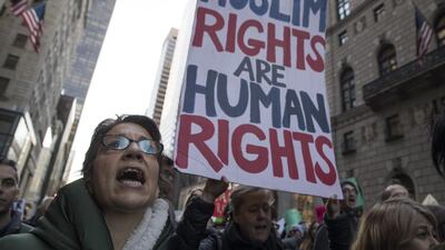 A demonstrator at a rally outside Trump Tower in New York on Saturday, protesting against President-elect Donald Trump. Mary Altaffer / AP