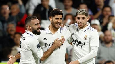 Real Madrid's Marco Asensio celebrates scoring their third goal with Dani Carvajal and Federico Valverde. Reuters