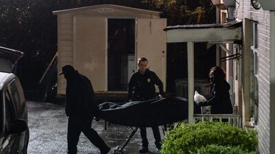 People with the medical examiner's office wheel out a body on a stretcher from a massage parlor where three people were shot and killed in Atlanta, Georgia. Eight people were killed in shootings at three different spas in the US state of Georgia on March 16 and a 21-year-old male suspect was in custody, police and local media reported, though it was unclear if the attacks were related. AFP