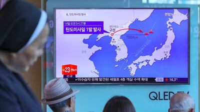 People watch a television news programme, showing a graphic of a North Korean missile launch, at a railway station in Seoul. North Korea fired a ballistic missile on May 14 in an apparent bid to test the South’s new liberal president and the US which have both signalled an interest in negotiations to ease months of tensions. AFP