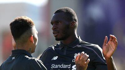 Christian Benteke, right, celebrates scoring the first goal for Liverpool. Reuters / Alex Morton