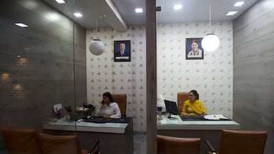 Staff at Broadway Immigration Service, which provides English coaching classes and consultancy services to people preparing to move abroad to study or work