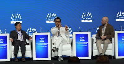 Joseph Zeng, founder and CIO of Arcadia Fund Management, and Weber Su, LinkerBot’s vice president and head of global markets, with The National’s Salim Essaid at AIM Summit in Dubai. Photo: AIM Summit