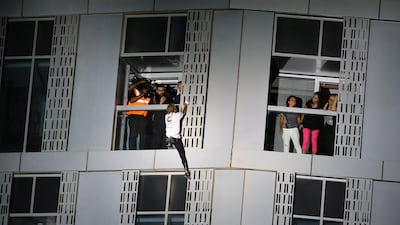 Alain Robert scales the Cayan Tower, the world’s tallest twisted building, in Dubai Marina. Marwan Naamani / AFP