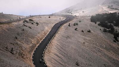 Tke peloton descends Mont Ventoux.