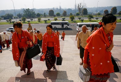 Members of parliament from National League for Democracy (NLD) party, led by Aung San Suu Kyi, wearing protective face masks arrive to attend the Assembly of the Union at the parliament building in Naypyitaw, Myanmar, 10 March EPA