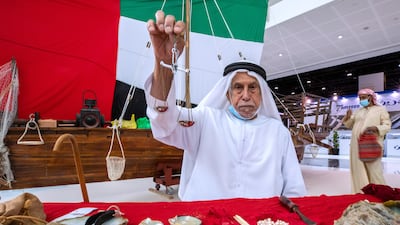 Hathbor Al Rumaithi, a pearl diver from Ras Al Khaimah, attends Adihex. Victor Besa / The National