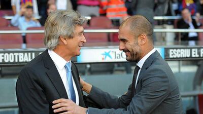 Pep Guardiola, right, will replace Manuel Pellegrini, left, as Manchester City manager at the end of the season. Lluis Gene / AFP