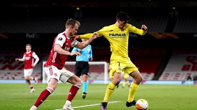 Arsenal's Rob Holding and Villarreal's Moreno Gerard battle for the ball during the UEFA Europa League Semi Final at the Emirates Stadium, London. PA