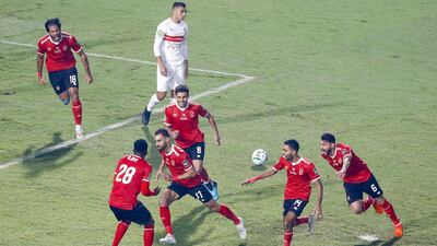 Al Ahly midfielder Amr El Soleya, centre, celebrates putting his team 1-0 up. AFP