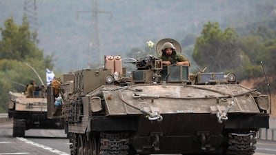 Israeli soldiers in armoured vehicles near the northern town of Kiryat Shmona close to the border with Lebanon. AFP