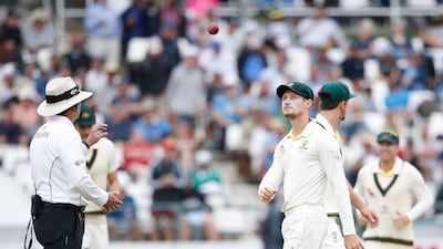 Australia's Cameron Bancroft throws the ball to umpire Richard Illingworth on Day 3 of the Newlands Test. Gianluigi Guercia / AFP