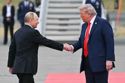US President Donald Trump greets his Russian counterpart Vladimir Putin on the tarmac after they arrived in Anchorage, Alaska, for talks in August. AFP