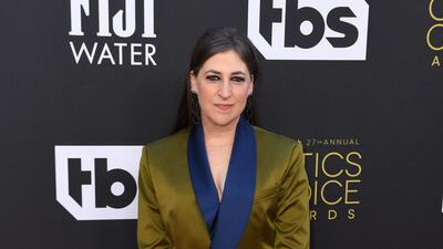 US actress Mayim Bialik arrives in an olive green satin suit. AFP