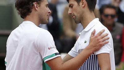 Novak Djokovic, right, has suffered a meteoric fall since his French Open title win last year. Ian Langsdon / EPA