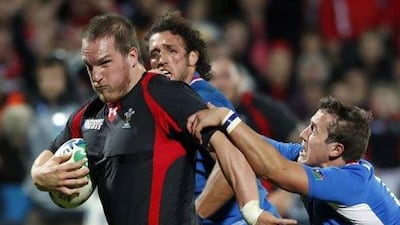 Namibia's Theuns Kotze, right, attempts to tackle Wales' Gethin Jenkins during their Rugby World Cup Pool D match at Stadium Taranaki in New Plymouth September 26, 2011. Nigel Marple / Reuters